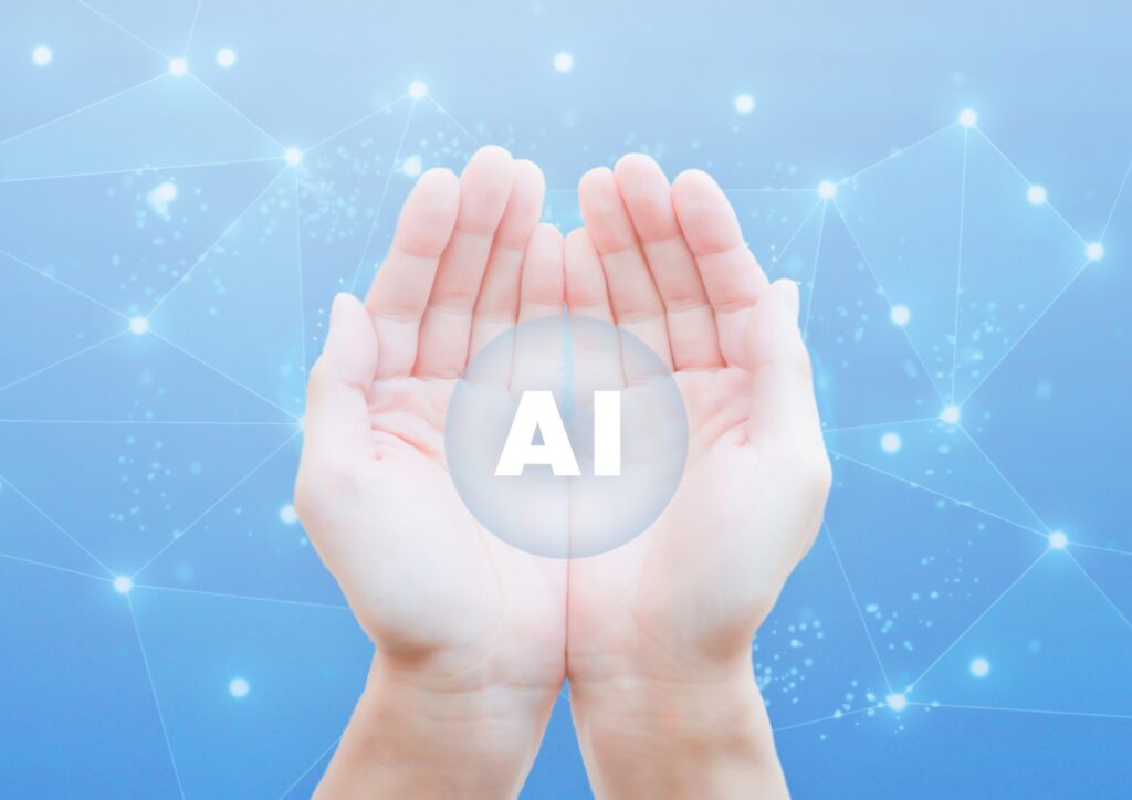 両手のひらの上に浮かぶ「AI」の光の球