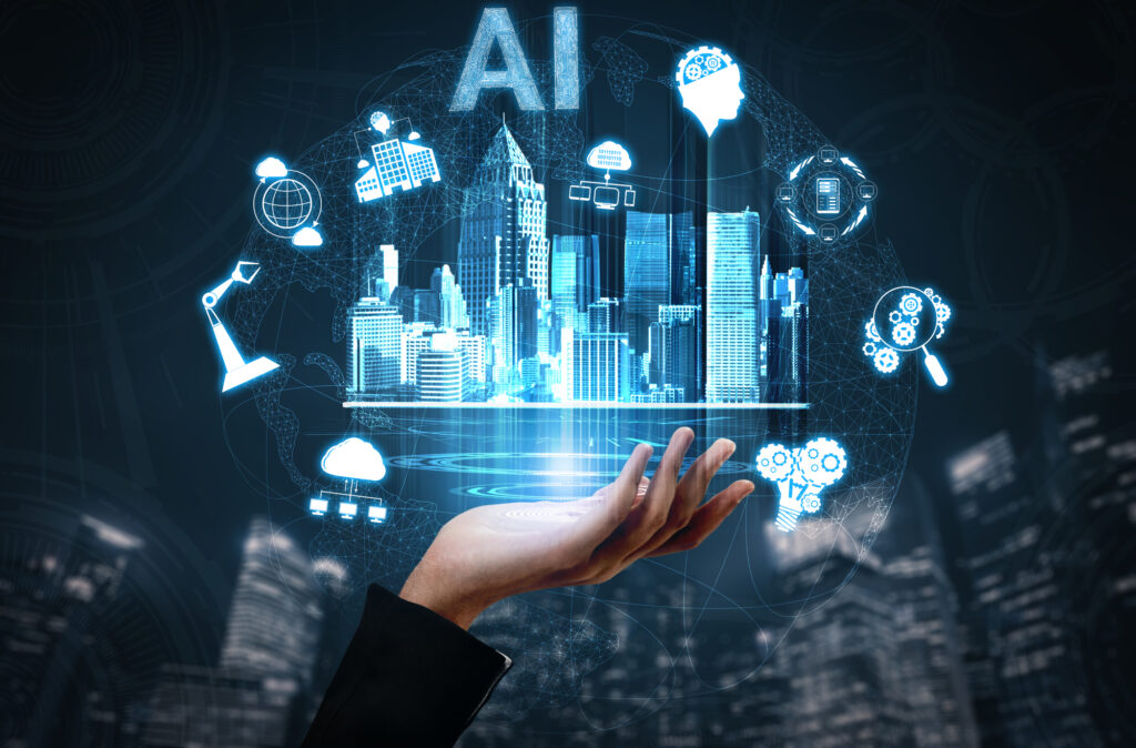 手のひらの上に浮かぶ高層ビル群と「AI」の文字、周りのアイコン